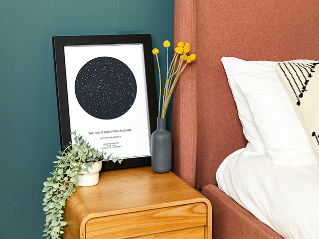 framed poster by the bedside