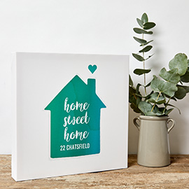 frame next to a house plant